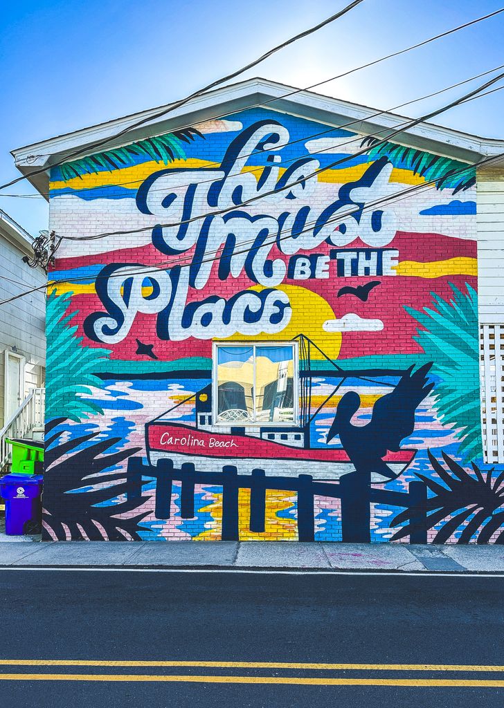 Colorful mural at Carolina Beach, NC captures the vibrant coastal atmosphere. Perfect spot for street art lovers.